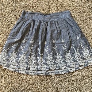 XXI soft blue/denim looking midi skirt with floral eyelet design size medium